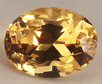 10987 A 1.74 Carat ovall brilliant heliodore from the Roebling/Merryall MIne, Litchchfield, Ct.  The gem exhibets an exceptional vivid medium toned golden hue.