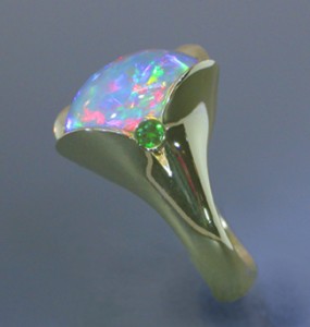 Despite its many colors, opal is a difficult stone to accent. 3mm round tsavorite garnets  
