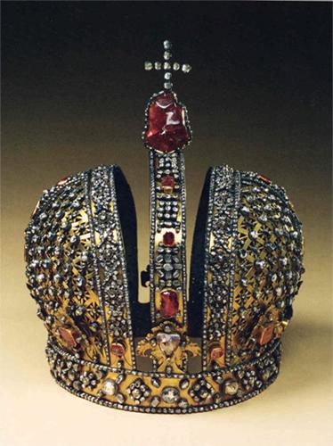 Made in 1731 by G. W. Dunkel, this crown in surmounted by a magnificent uncut red tourmaline of exceptionally pure red hue.