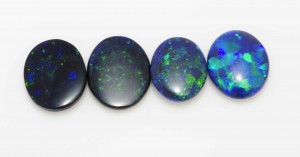 Saturation levels in opal.  Viewed from left to right the stones show higher levels of saturation (brightness).  Be careful of the last one on the right as it depicts a pattern of large flashes which will appear brighter than the smaller more discrete pinfire play of color in the images to the left.
